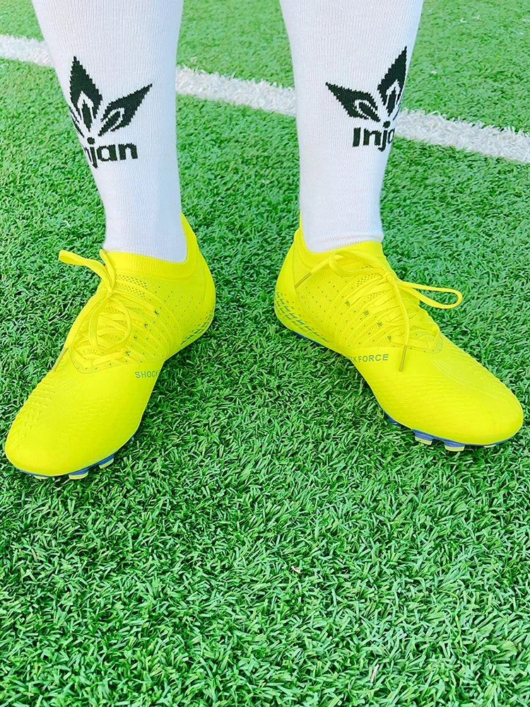 Men's football shoes with long spikes and anti slip turf for indoor training and sports. Five person football shoes for professi