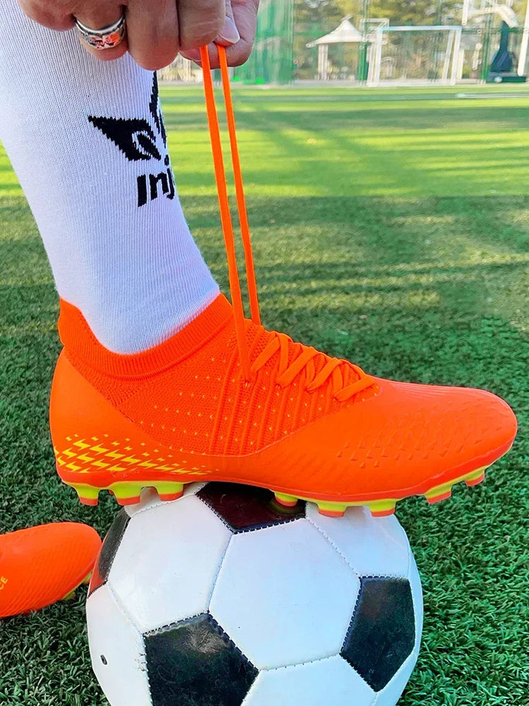 Men's football shoes with long spikes and anti slip turf for indoor training and sports. Five person football shoes for professi